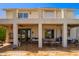 Rear view of the house with a covered patio and balcony overlooking the backyard at 21483 N 65Th Ave, Glendale, AZ 85308