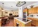 Open-concept kitchen flowing into the dining and living areas offers a bright cooking space at 21483 N 65Th Ave, Glendale, AZ 85308