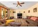 Comfortable living room with hardwood floors, area rug, ceiling fan, and access to the backyard at 21483 N 65Th Ave, Glendale, AZ 85308