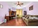 Inviting living room offers comfortable seating, wood floors, and ample workspace at 21483 N 65Th Ave, Glendale, AZ 85308