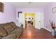 Comfortable living room with hardwood floors leading to another room at 21483 N 65Th Ave, Glendale, AZ 85308