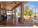 Covered patio featuring stone flooring and views of the pool and backyard at 21483 N 65Th Ave, Glendale, AZ 85308