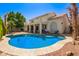 Inviting backyard pool with a spacious deck, complemented by a lovely two-story home exterior at 21483 N 65Th Ave, Glendale, AZ 85308