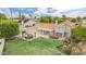 An aerial view showcasing the expansive backyard with pool, patio, pergola, play structure, and lawn at 2431 E Laurel St, Mesa, AZ 85213