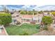A high aerial view showcasing the expansive backyard with pool, patio, pergola, and play structure at 2431 E Laurel St, Mesa, AZ 85213