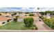 A high aerial view showcasing a home with mature landscaping, lush front lawn, and a long paver driveway at 2431 E Laurel St, Mesa, AZ 85213