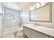 Bathroom featuring a shower and bathtub combination, as well as a marble countertop at 2431 E Laurel St, Mesa, AZ 85213