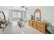 Bedroom featuring natural lighting, a large wooden dresser, and a queen bed at 2431 E Laurel St, Mesa, AZ 85213