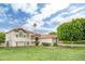 Beautiful stucco home with red tile roof, stone accents, and a large lawn at 2431 E Laurel St, Mesa, AZ 85213