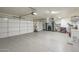 Spacious three-car garage with epoxy flooring and ample storage space, providing functionality and room for vehicles at 2431 E Laurel St, Mesa, AZ 85213