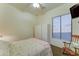 Relaxing bedroom featuring a ceiling fan, closet, and cozy bed with stylish bedding at 329 S Marin Dr, Gilbert, AZ 85296