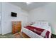 Spacious bedroom with a dresser, closet, window and comfortable bed at 329 S Marin Dr, Gilbert, AZ 85296