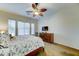Bedroom with a ceiling fan, dresser, and bright natural light at 329 S Marin Dr, Gilbert, AZ 85296