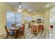 Cozy dining area with wood table, adjacent to the kitchen and bright window at 329 S Marin Dr, Gilbert, AZ 85296