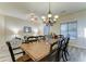 Dining area with wooden table, chandelier, and natural light at 329 S Marin Dr, Gilbert, AZ 85296