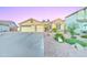 Charming home with a three-car garage and colorful, well-maintained landscaping at 329 S Marin Dr, Gilbert, AZ 85296