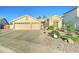 Charming single-story home boasting a three-car garage and low maintenance desert landscaping at 329 S Marin Dr, Gilbert, AZ 85296