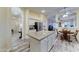 Open kitchen with island, breakfast area, and stainless steel refrigerator at 329 S Marin Dr, Gilbert, AZ 85296