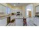 Spacious kitchen with island, breakfast bar, and stainless steel appliances at 329 S Marin Dr, Gilbert, AZ 85296