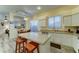 Bright kitchen with granite countertops, island with seating, and stainless steel appliances at 329 S Marin Dr, Gilbert, AZ 85296