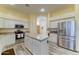 Bright kitchen with white cabinets, stainless appliances, and granite countertops with a center island at 329 S Marin Dr, Gilbert, AZ 85296