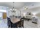 Open concept dining and living area with decorative chandelier at 329 S Marin Dr, Gilbert, AZ 85296