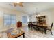 Open living and dining area with ceiling fan and wood flooring at 329 S Marin Dr, Gilbert, AZ 85296