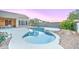 Lovely pool and patio with a spa, desert landscaping, and an outdoor dining area at 329 S Marin Dr, Gilbert, AZ 85296