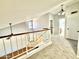 Hallway view shows an open landing with railing and carpeted floors, connecting various rooms and areas at 4028 E Mountain Sage Dr, Phoenix, AZ 85044