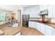 Spacious kitchen featuring granite countertops, stainless steel appliances, and ample white cabinetry at 404 E Coconino Pl, Chandler, AZ 85249