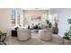 Inviting living room with large windows and neutral décor, creating a comfortable atmosphere at 404 E Coconino Pl, Chandler, AZ 85249