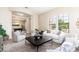 Bright living area features ample seating, large windows, and an open layout for entertaining at 404 E Coconino Pl, Chandler, AZ 85249
