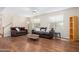 Inviting living room featuring wood floors, two sofas, and a ceiling fan at 404 E Coconino Pl, Chandler, AZ 85249