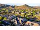 Panoramic aerial view of the community, showcasing mountain views and houses with solar panels at 41715 N River Bend Rd, Phoenix, AZ 85086