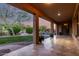 An expansive back patio overlooks a verdant backyard with a pool and fountain, perfect for outdoor relaxation at 41715 N River Bend Rd, Phoenix, AZ 85086
