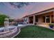 Lush backyard with a pool, fountain, and manicured landscaping for ultimate relaxation at 41715 N River Bend Rd, Phoenix, AZ 85086