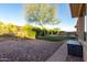 Spacious backyard featuring a fountain and desert landscaping, offering privacy and tranquility at 41715 N River Bend Rd, Phoenix, AZ 85086