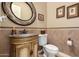 Elegant half bath features a marble vanity and patterned wallpaper at 41715 N River Bend Rd, Phoenix, AZ 85086