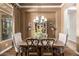 Formal dining room with chandelier lighting, elegant chairs, and stylish furnishings for sophisticated dining at 41715 N River Bend Rd, Phoenix, AZ 85086