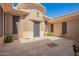 Exterior entrance of the home with a decorative security door and paver walkway at 41715 N River Bend Rd, Phoenix, AZ 85086