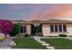 Attractive home with manicured lawn and stepping stone pathway to the entrance at 41715 N River Bend Rd, Phoenix, AZ 85086