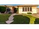 Inviting home with lush green lawn and decorative stone pathway at 41715 N River Bend Rd, Phoenix, AZ 85086