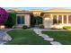 Beautiful front exterior with manicured landscaping and a stone pathway at 41715 N River Bend Rd, Phoenix, AZ 85086