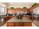 Beautiful kitchen featuring an island with granite countertops and modern stainless steel appliances at 41715 N River Bend Rd, Phoenix, AZ 85086