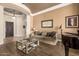 Elegant living room features a decorative ceiling, comfortable seating, and modern decor at 41715 N River Bend Rd, Phoenix, AZ 85086
