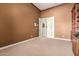 Spacious office space featuring neutral carpet, crown moulding, and decorative wood built-ins at 41715 N River Bend Rd, Phoenix, AZ 85086