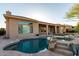 Stunning backyard pool and spa with rock features, creating a serene and luxurious outdoor space at 41715 N River Bend Rd, Phoenix, AZ 85086