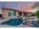 Gorgeous backyard pool and spa with rock features, perfect for relaxation and outdoor enjoyment at 41715 N River Bend Rd, Phoenix, AZ 85086