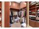 Spacious walk-in closet with extensive shelving and hanging storage for optimal organization at 41715 N River Bend Rd, Phoenix, AZ 85086