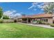 This home features a large backyard, patio and green lawn for outdoor enjoyment at 4620 E Desert Cactus St, Phoenix, AZ 85032